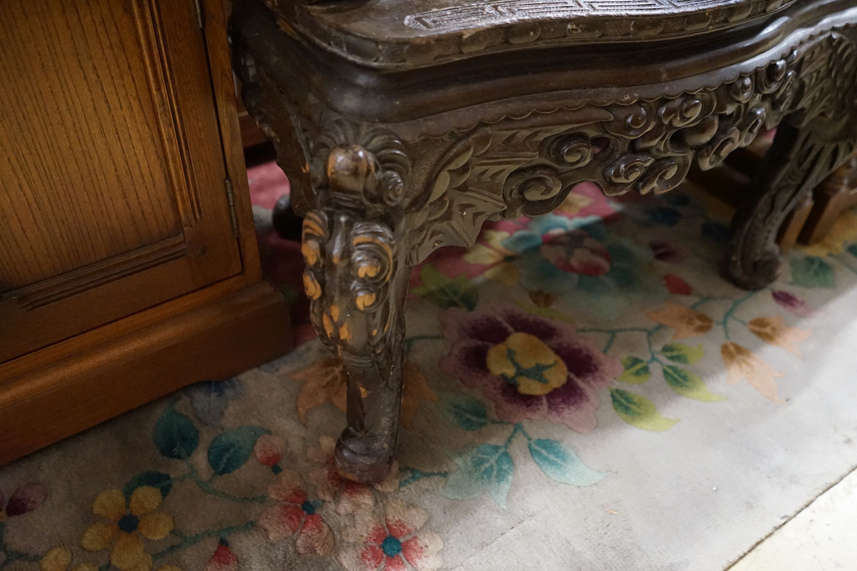 A Chinese carved hardwood 'dragon' elbow chair, width 68cm, depth 47cm, height 88cm